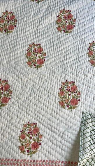 Flat lay close-up of Jaipur Hand Block Print quilted coverlet textile texture and detail