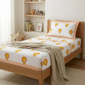 Cartoon Lion print bedding on a single bed in a boy's kid room